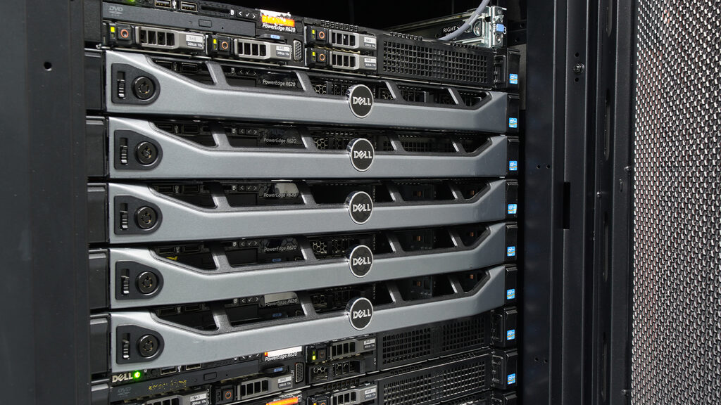 Enterprise rack servers stacked behind a mesh cabinet door at our colocation facility